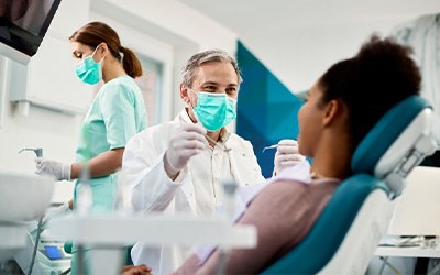 Dentist treats patient